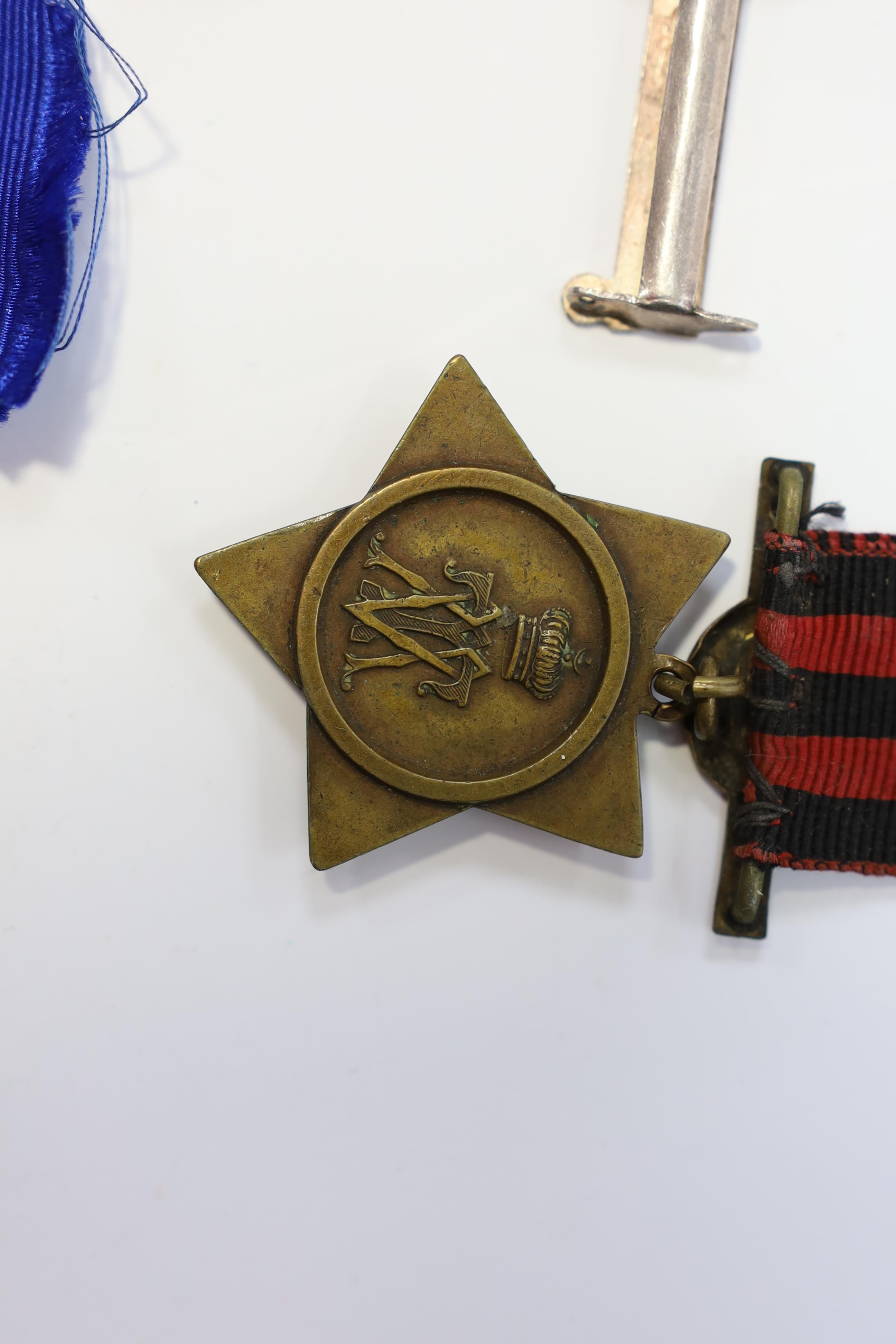 Replica medals; Khedive's Star 1884-6 and another undated; Ashanti star; Spink British North Borneo medal, a loose North West Frontier 1930-31 clasp and a Total Abstinence India medal 50-80